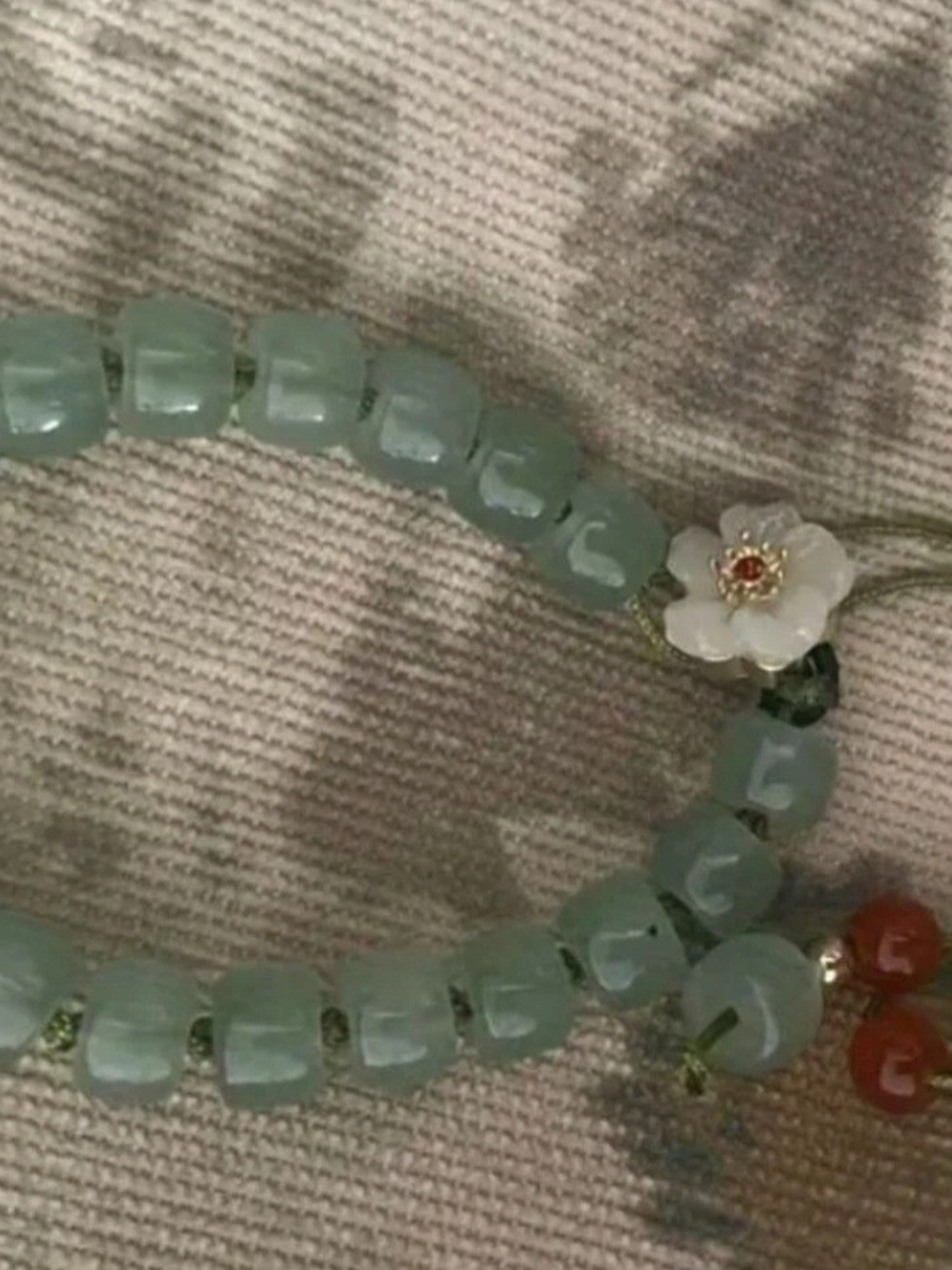 Delicate Light Green Beaded Bracelet with Floral Accent